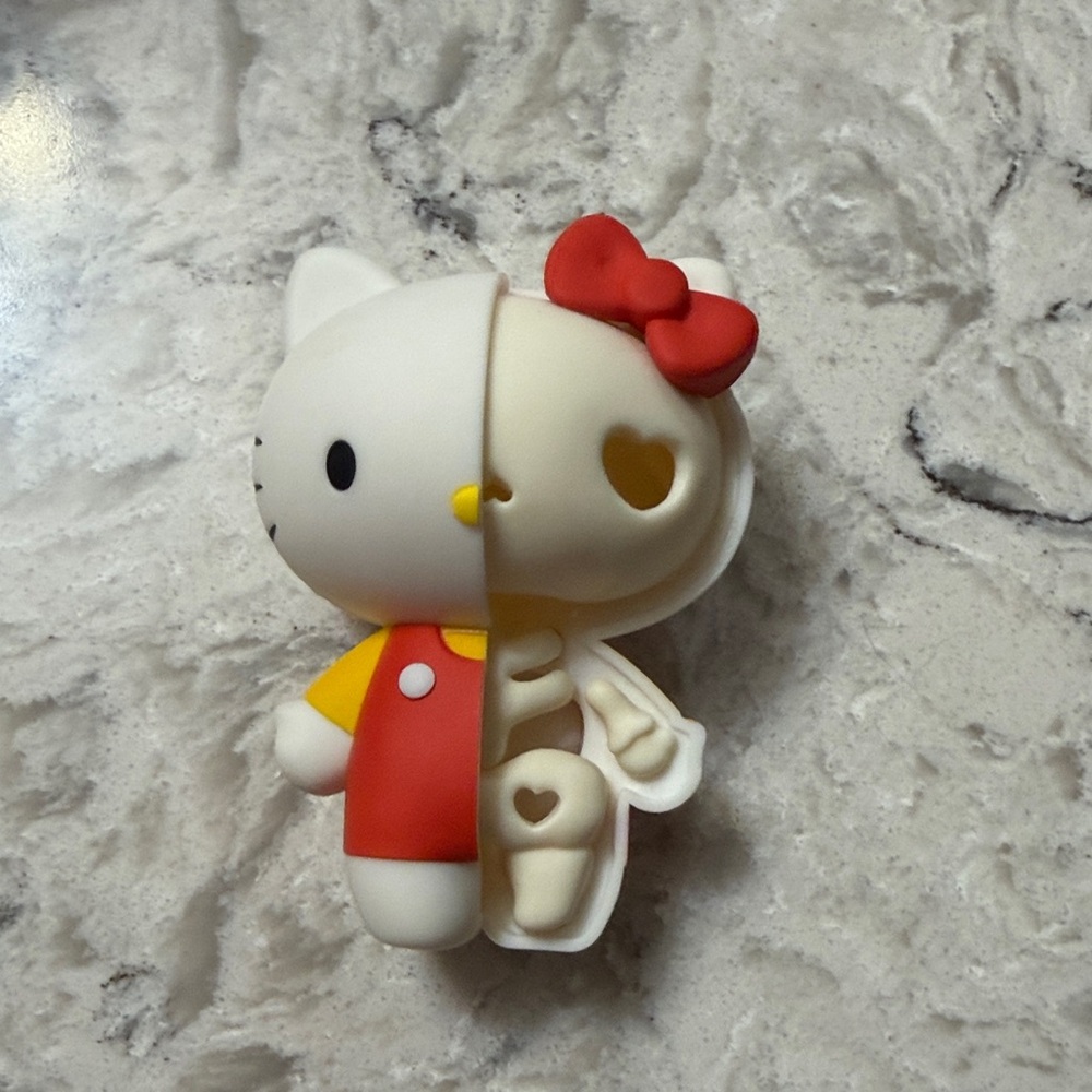 Hello kitty half skeleton figure